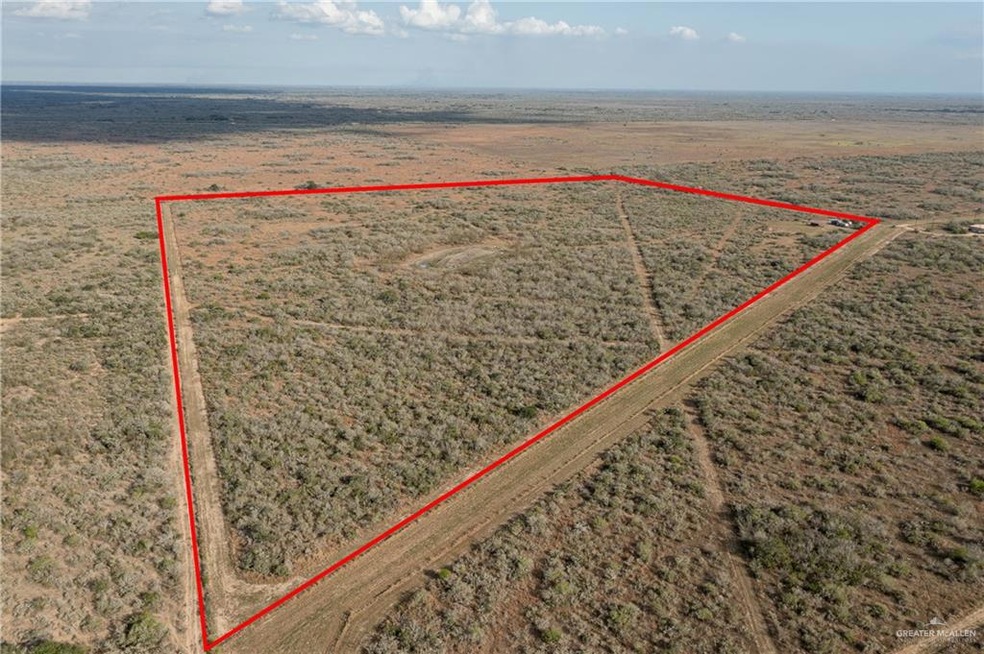 Birds eye view of property with a rural view