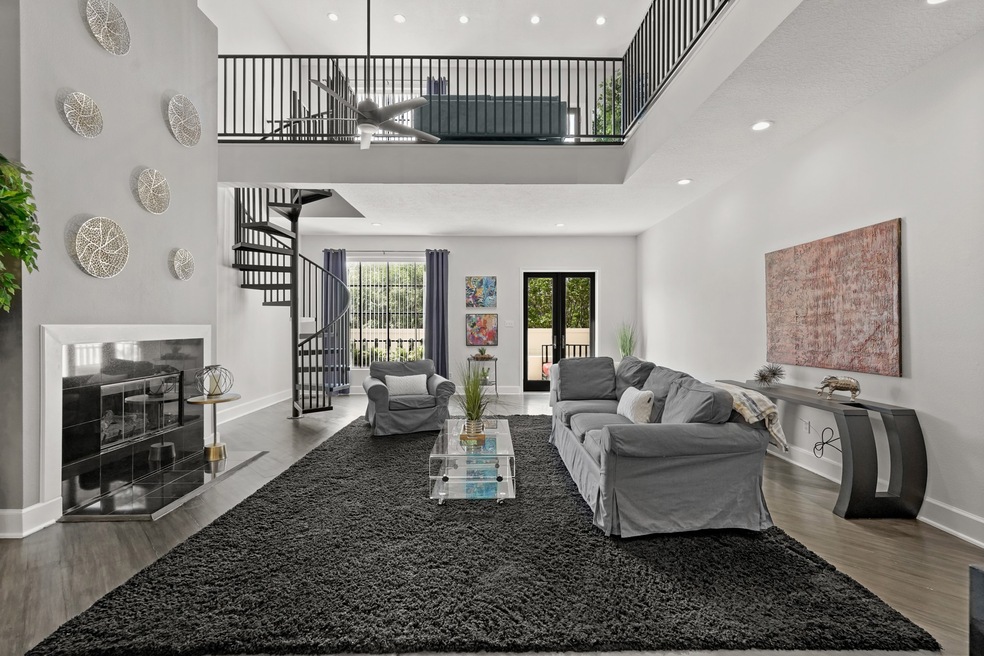 Second Level Open Concept Living Room with Tall Ce