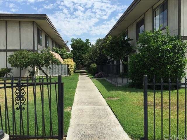 lovely treelined walkway from parking lot to unit