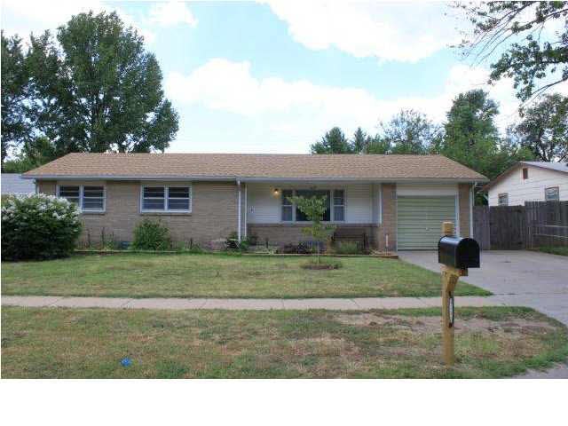 Gorgeous brick fron elevation. Extra wide driveway