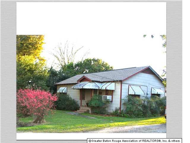 Front, right 3/4 view. Extra wide lot.