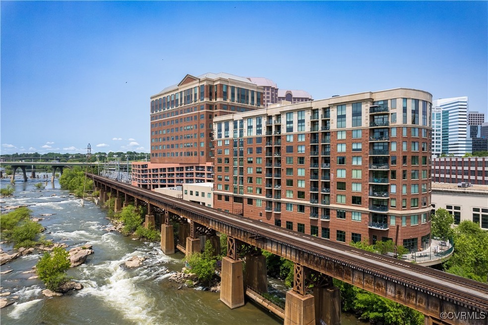 View of property with a water view