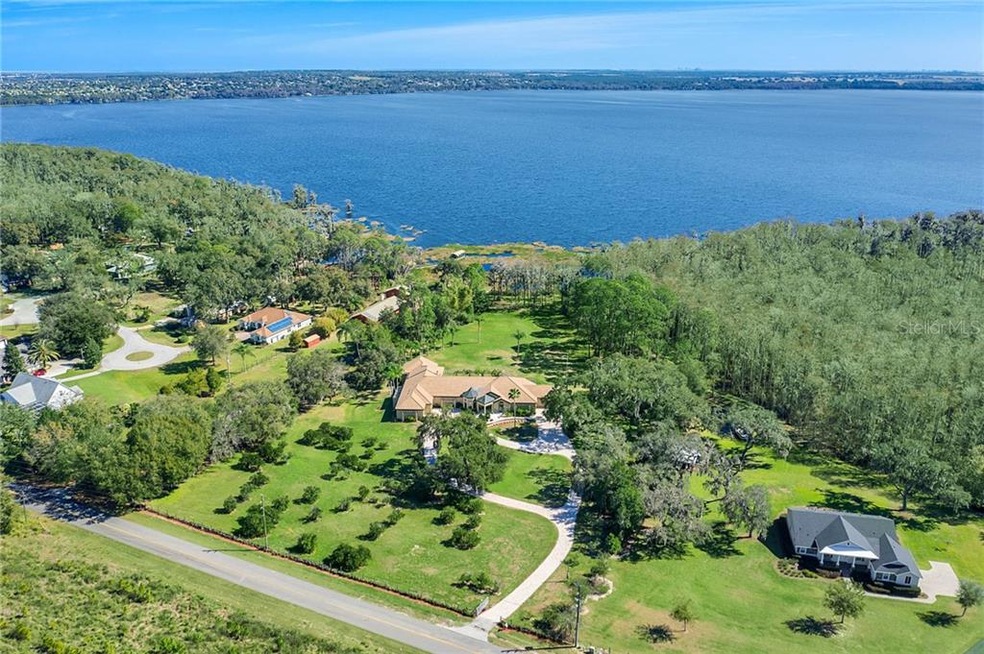 6.6 acres on Lake Louisa with lake and canal front