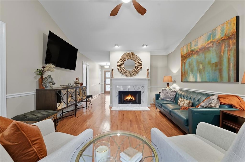 ceiling, a fireplace, and a ceiling fan