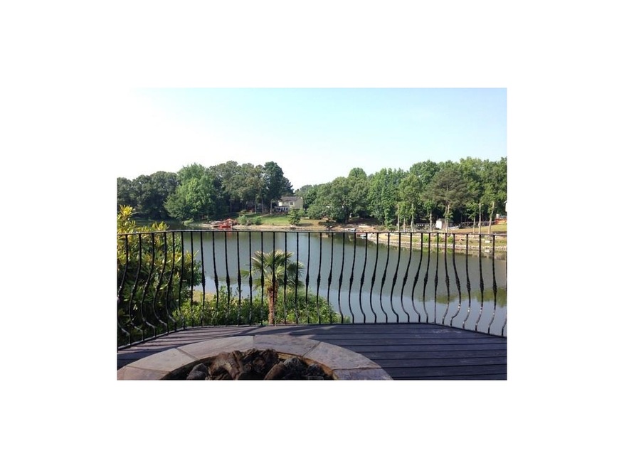 Peaceful deck overlooking private lake