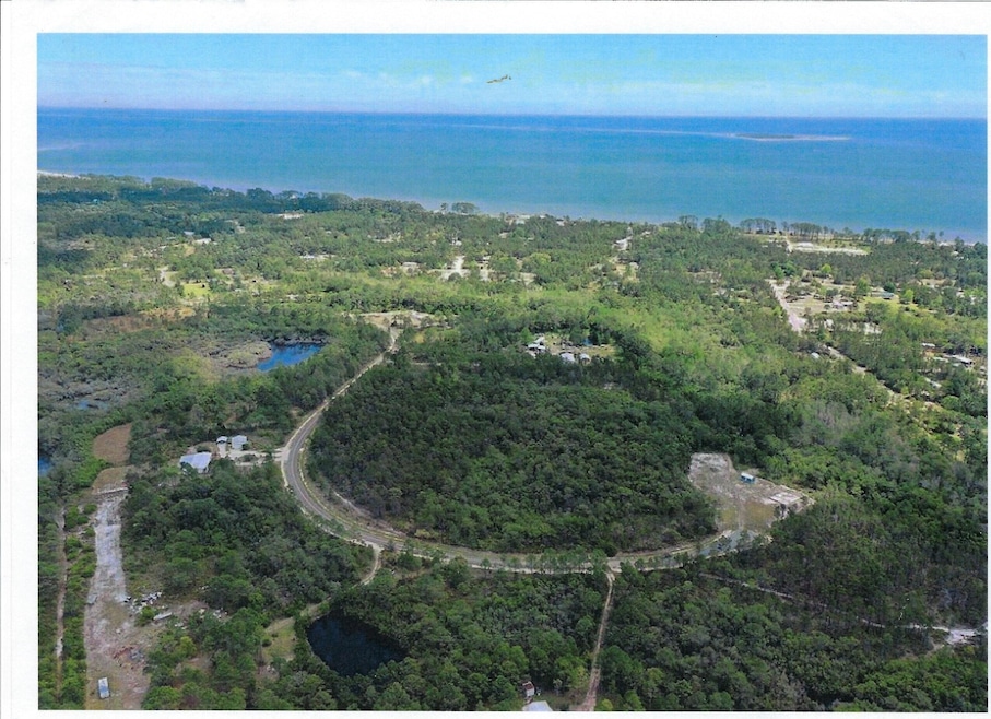 Aerial view of Property and Gulf