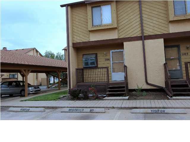 Front of Condo with 2 assigned parking spaces. 1 C