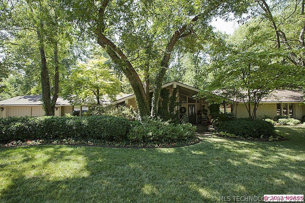 Updated to perfection on almost a half acre wooded