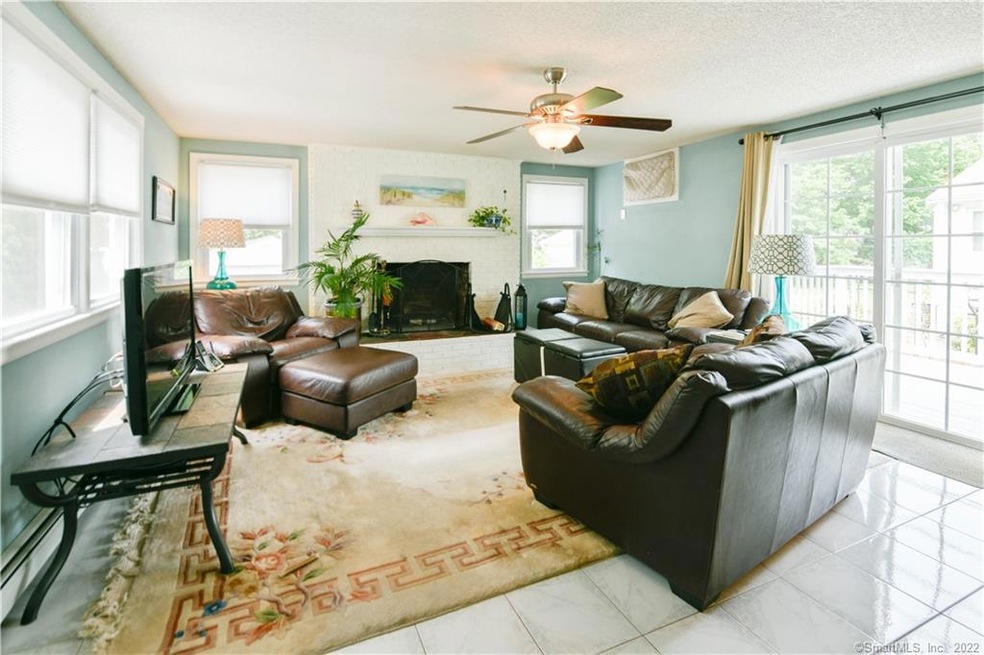 Inviting family room with fire place and sliders l