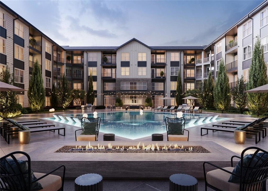 View of pool featuring a patio area and a fire pit