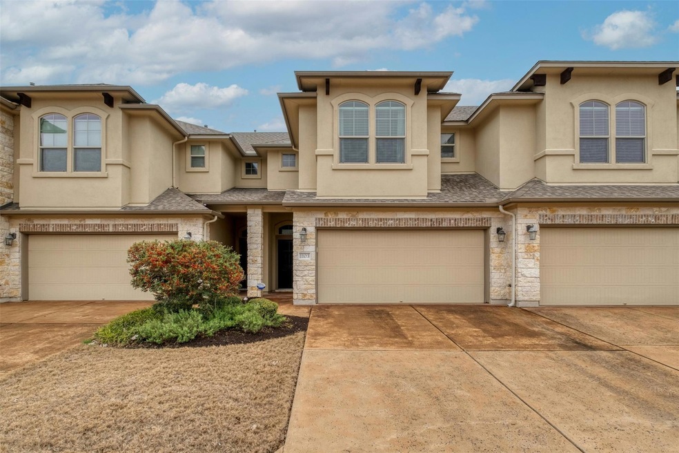 View of property with stucco siding, an attached 