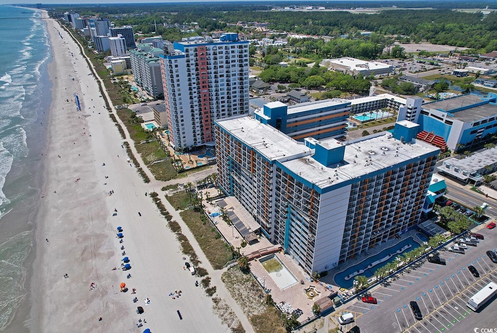 Bird's eye view of waterfront with a beach
