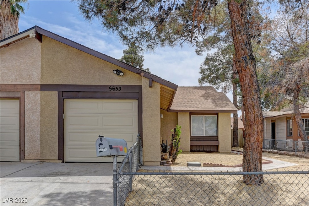 View of front facade featuring stucco siding, an a