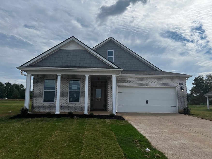 View of front of home featuring a garage and a fro
