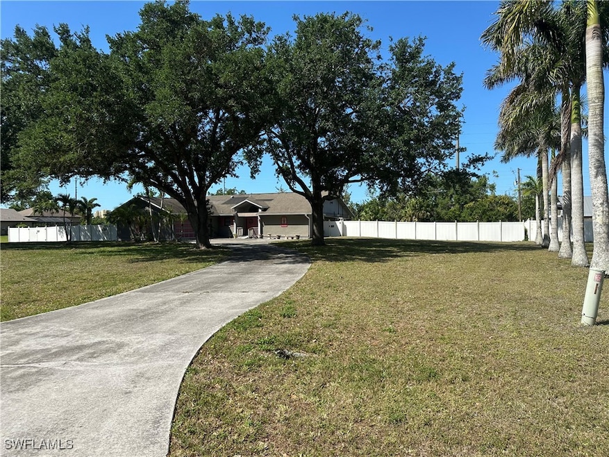 View of Front of House with Circular Driveway, Bea