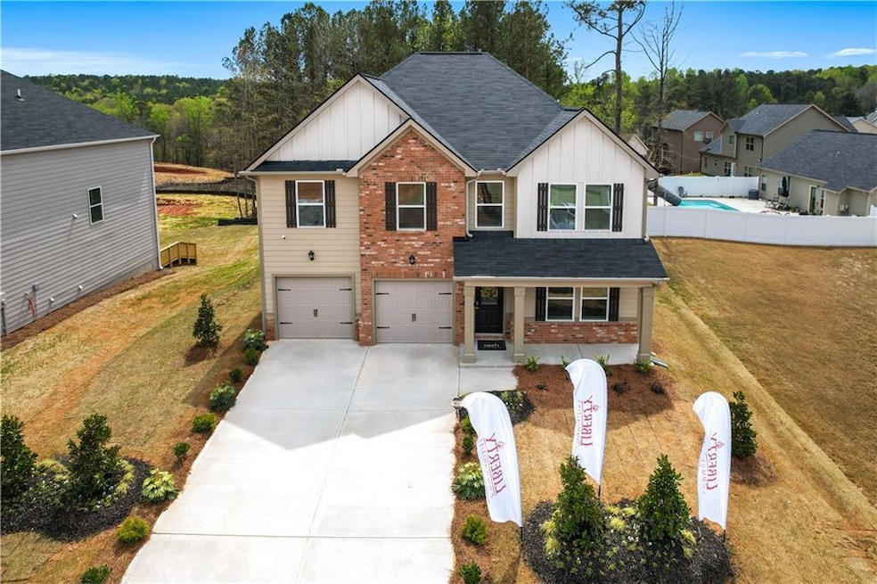 View of front of property with concrete driveway, 