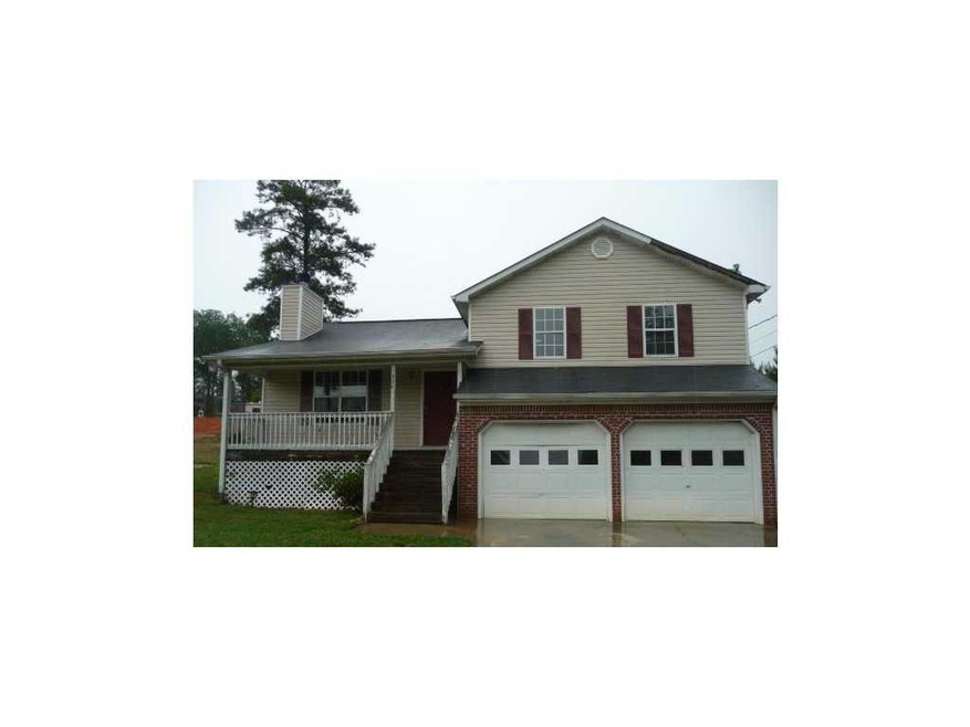Exterior Front. Brick accents and rocking chair po