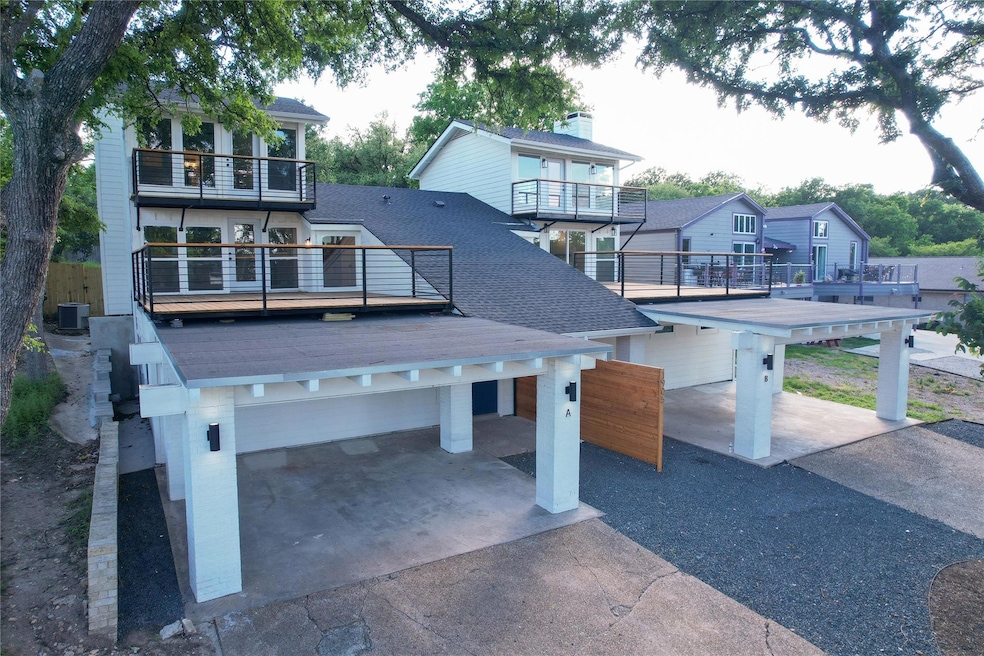 View of community with asphalt driveway and a res