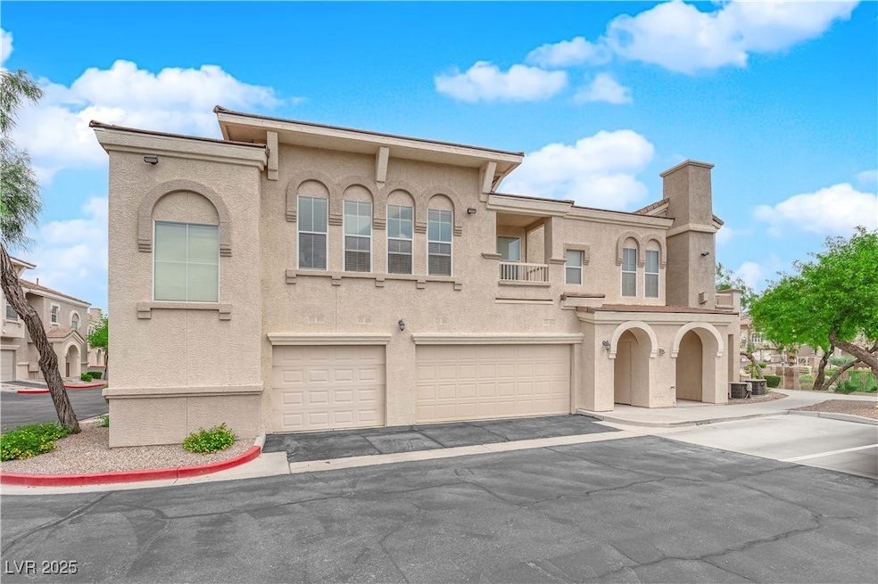 View of front facade with driveway, an attached ga