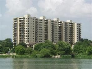 View of property with a water view