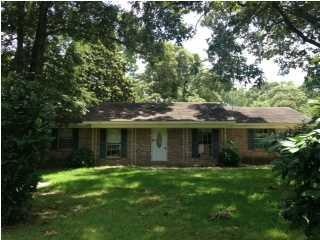 nice brick home that sits deep in the large lot wi