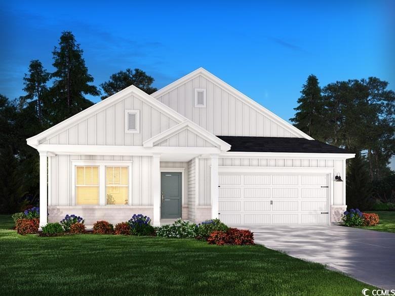 View of front of property with a front yard and a 
