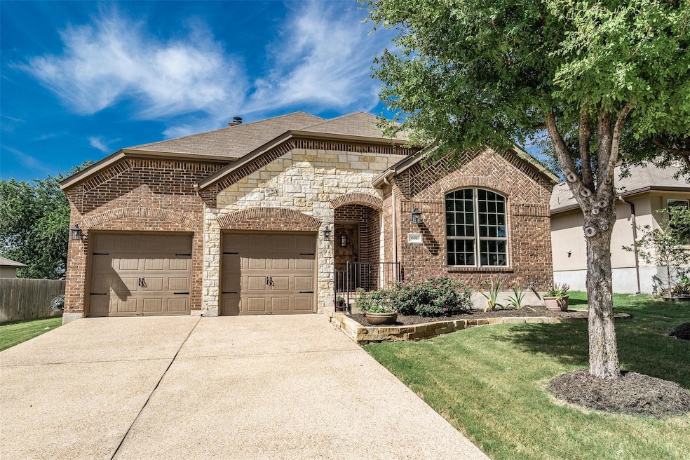 French country style house with driveway, an atta