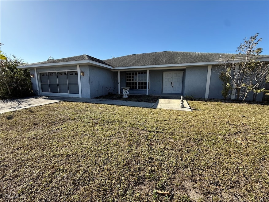 Ranch-style home featuring stucco siding, an attac