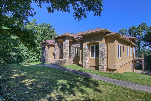 Top of the mountain home has two driveways, each d
