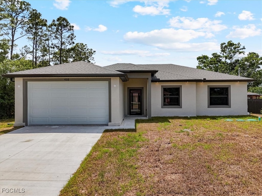 View of front of property featuring concrete drive