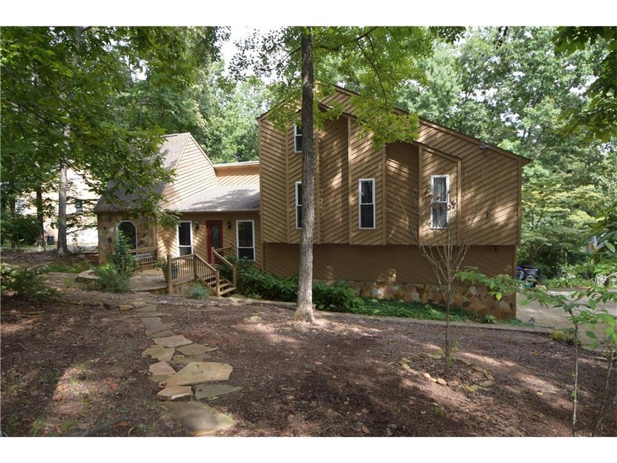 large stone front porch plus on the rear a large v