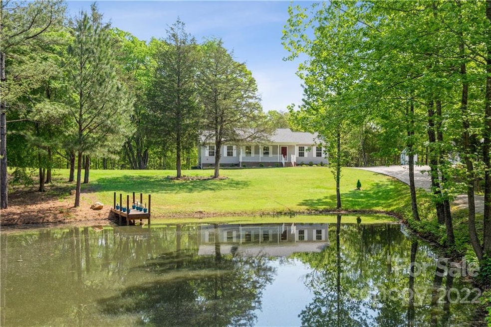 Ranch home in peaceful countryside setting with 12.3 acres.  Enjoy the front porch view of your very pond.