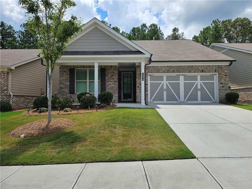 View of front of property with a garage and a fron