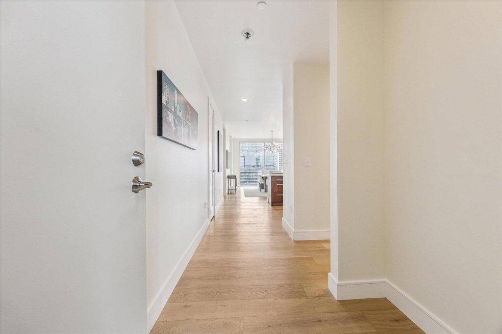 Corridor with recessed lighting, baseboards, a no