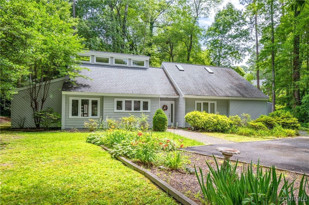 Mid-century inspired home with a shingled roof and