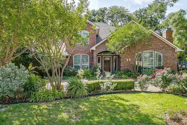 Traditional-style house featuring brick siding, a 