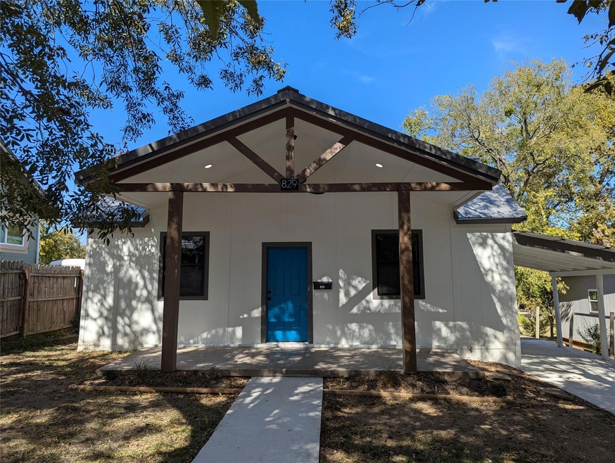 View of front of house with a carport