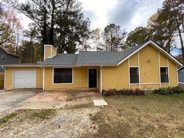 Single story home featuring a garage