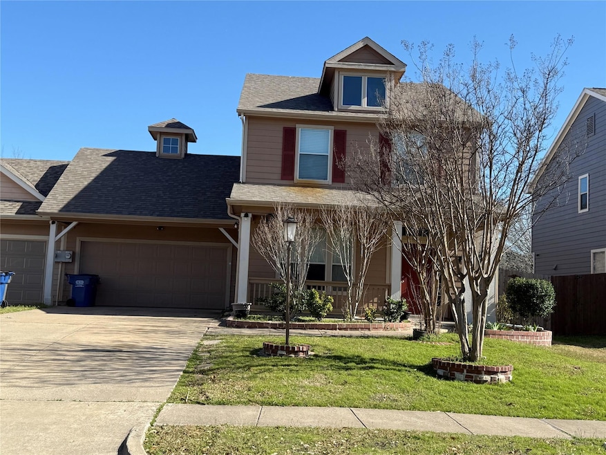 American foursquare style home with concrete drive