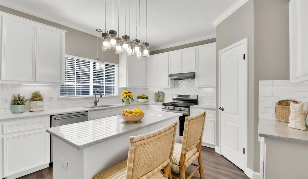 Kitchen featuring appliances with stainless steel
