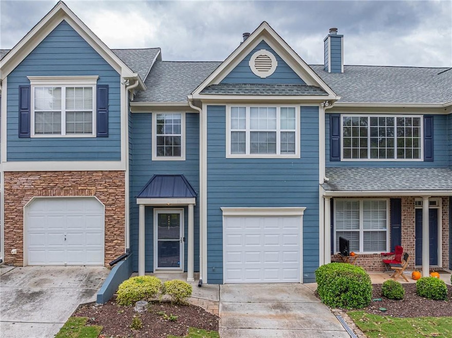 Townhome / multi-family property with a garage