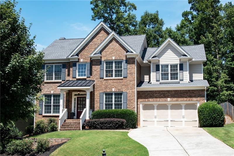 Gorgeous home features newer roof, upgraded carpet