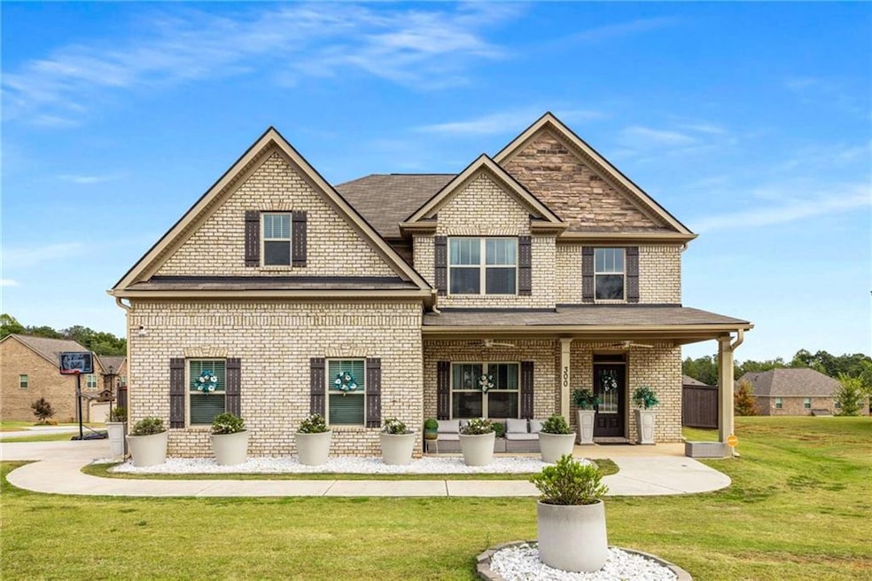 Craftsman house featuring a porch, a front yard, and brick siding