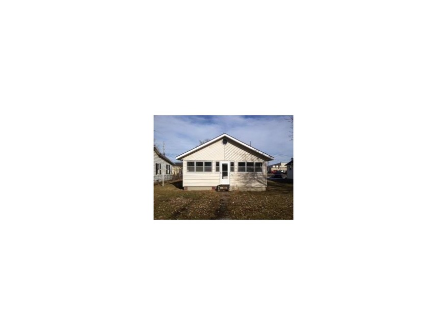 Front of home with enclosed porch.