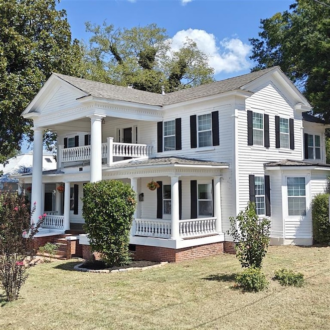 Neoclassical / greek revival house with a porch an