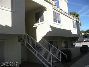 View of building exterior featuring stairway