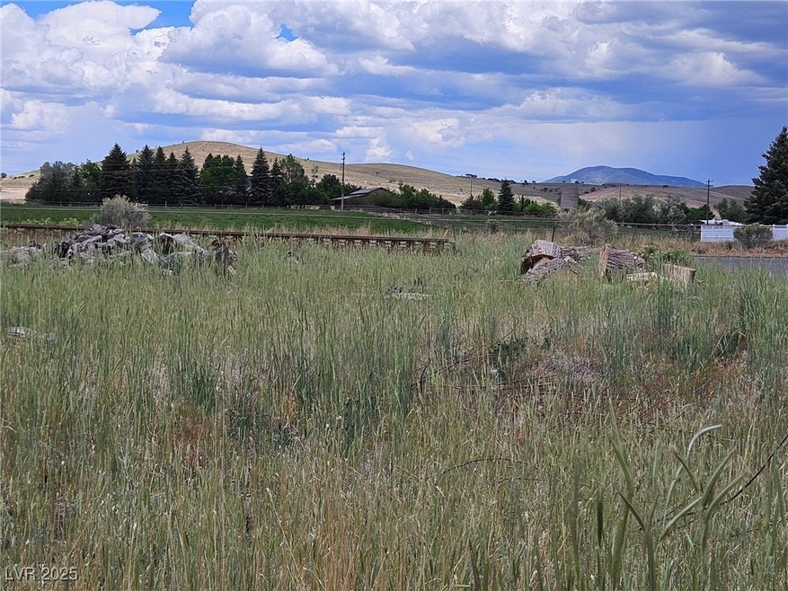 View of mountain backdrop with rural landscape
