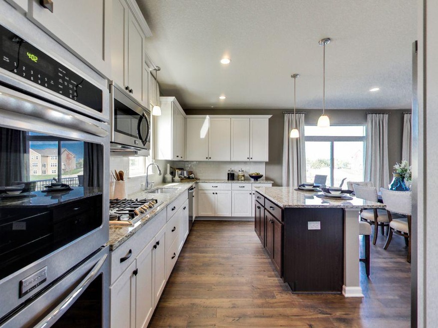A spacious kitchen with lots of cabinets, walk in 