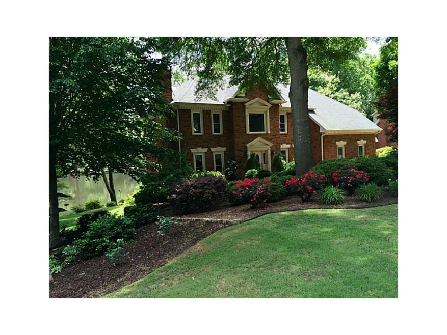 Exterior Front. Elegant Lake front home on levet t