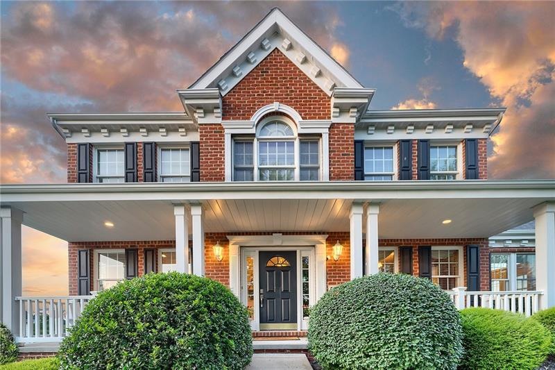 Imagine chilling under this front porch or a hammo